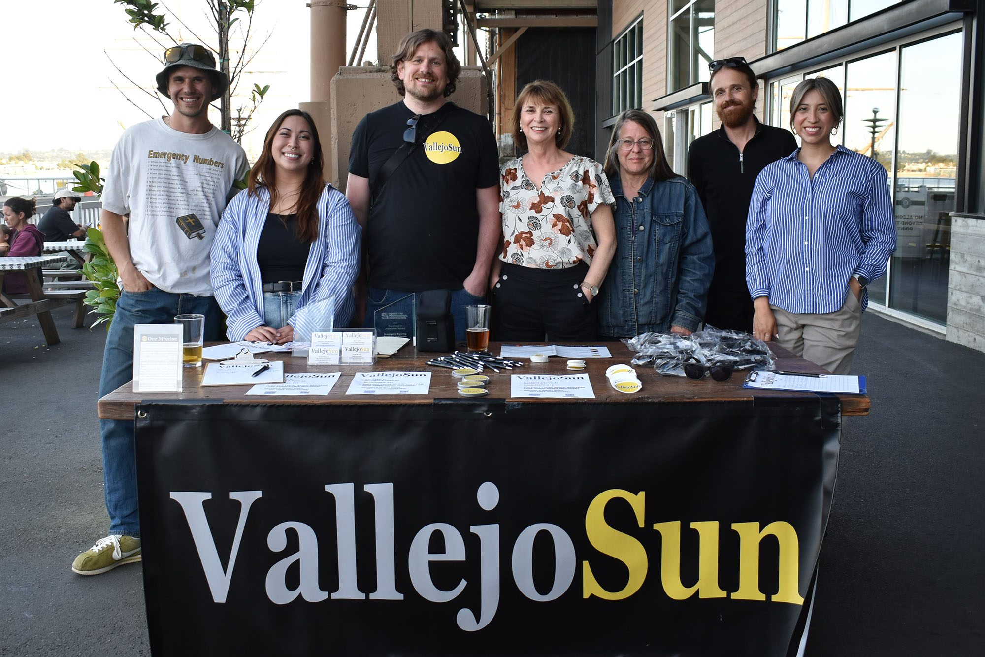 Group photo of the Vallejo Sun team at a community event.